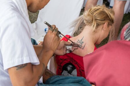 Thai Ancient Spells Tattoo or Sak Yant an traditional blessed tattoo with Khmer language script meaning bless for lucky and fortune most popular in Muay Thai Fighters. Ayutthaya. March 2018 Thailand.のeditorial素材