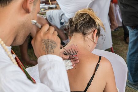 Thai Ancient Spells Tattoo or Sak Yant an traditional blessed tattoo with Khmer language script meaning bless for lucky and fortune most popular in Muay Thai Fighters. Ayutthaya. March 2018 Thailand.のeditorial素材