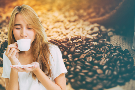 girl teen drinking coffee montage with coffee bean cafe decoration background.の写真素材