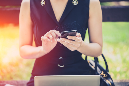 businesswoman using smartphone vintage color toneの写真素材