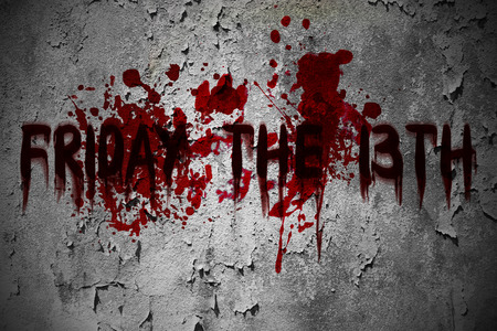 Friday the 13th horror scary grunge blood text on the dirty old wall.の写真素材