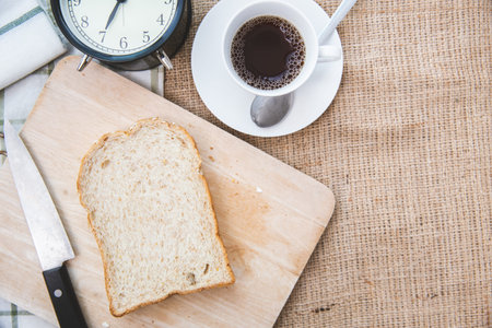 Whole grain bread with black coffee good healthy morning meal low fat food with space for text