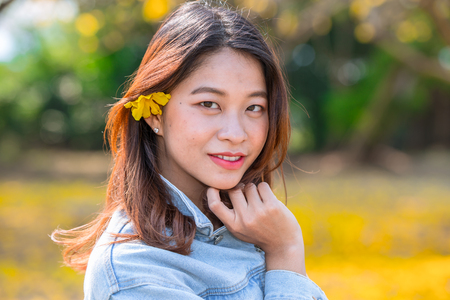portrait cute asian Thai woman with the flower beautiful girl.の写真素材