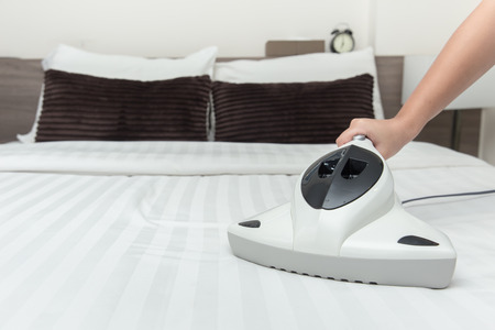 Mite vacuum cleaner using cleaning bed mattress dust eliminator with UV lampの写真素材