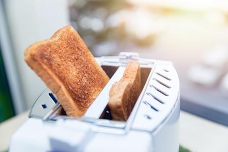 Toaster toasted bread sheet looking yummy for morning mealの写真素材