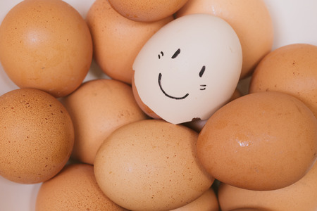 cute happy eggs smile face draw on shellの写真素材