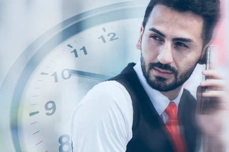business times contact and communication businessman on calling with clock overlay backgroundの写真素材