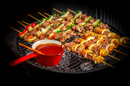 BBQ beef grill steak with dipping seasoning sauce in hot charcoal stove.の写真素材