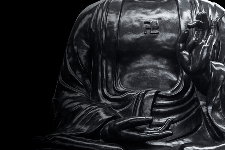 asian stone buddha statue in black with copy space for text art monotone.の写真素材
