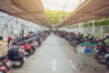 blur motorcycle parking area in Thailand shopping mall space outdoor for background.の写真素材