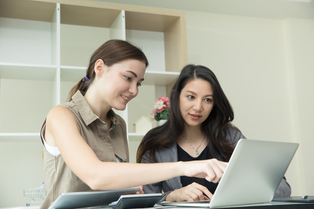 business women helping together training for employee friendship in office life.の写真素材