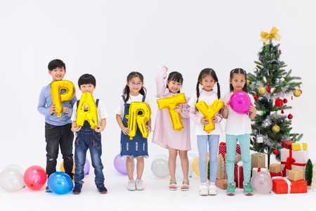 asian kids group christmas new year party isolated on white studio.の写真素材