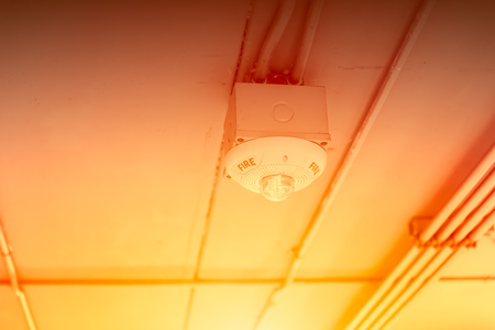 flame detector device hot fire and smoke sensor at ceiling roof.の写真素材