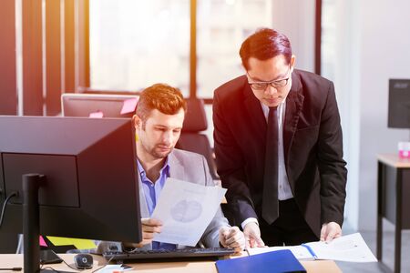 Businessman mix race help or working together in officeの写真素材