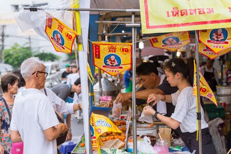 Vegetarian Festival (J Festival) In Thailand at Yaowarat or Bangkok China town street decoration with yellow flag for No animal meat food sign. 10 October 2018. Bangkok, THAILAND.のeditorial素材