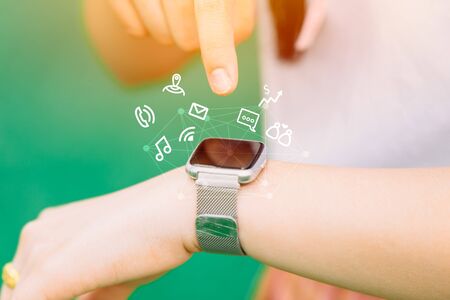 close-up people hand using smart watch in modern lifestyle convenience technologyの写真素材