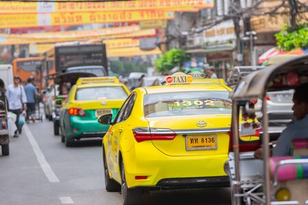 Colorful Taxi in busy traffic jam road in Bangkok Chinatown or Yaowarach. 13 October 2018. Bangkok, THAILAND.のeditorial素材