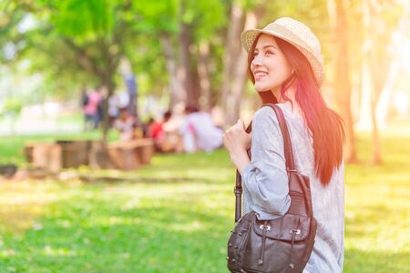 single Asian girl teen going travel outdoor happy moment to have activity in holidayの写真素材