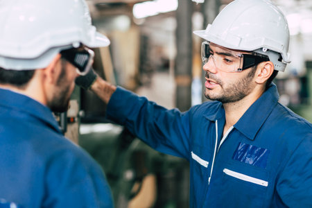 Engineer team talking together to discussion in factory workplace.