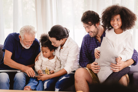 Lovely home happy family living together in living room father mother and grandfather playing with...