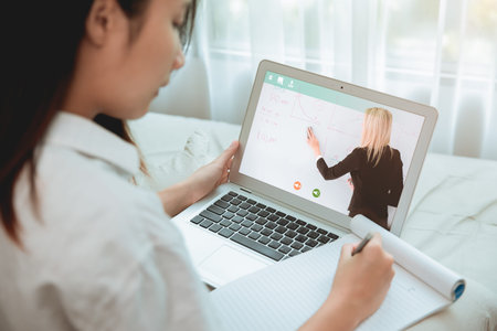 Homeschooling concept, Teen student Stay Home using onling classroom or E-Learning system for Self...
