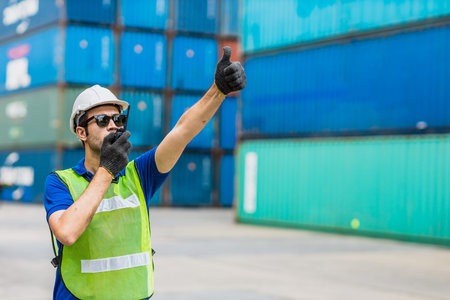 Foreman shipping staff worker working to control loading cargo port logistic for import export goods...