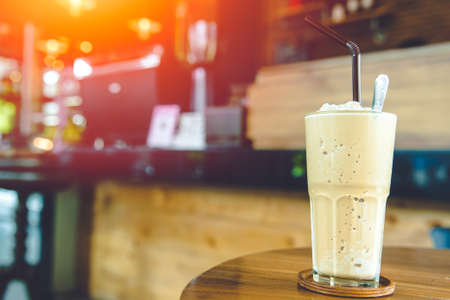 Coffee Smoothie milk shake sweet cool ice blended drink with caffeine refresh menu on coffee shop table with space for textの写真素材