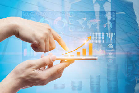 Smartphone touch screen overlay with business infographic technology chart step arrow up for communication rise profit wealth income conceptの写真素材