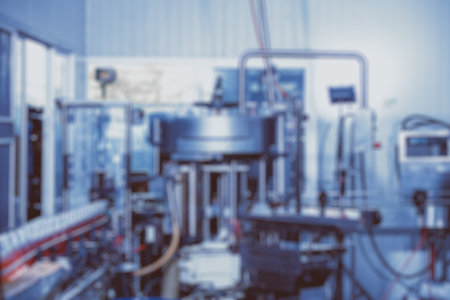blur drink automate no worker machine in food factory production line blue color tone abstract for...