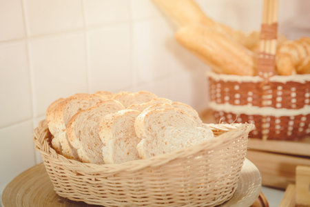 Whole wheat or whole grain sliced bread in wooden basket
