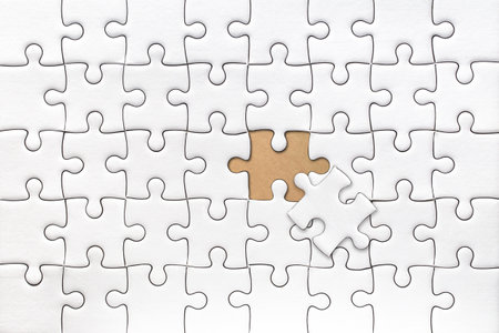 White blank jigsaw puzzle with last piece solve pattern texture for graphics design template.の写真素材