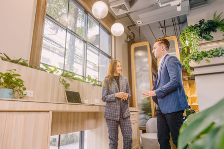 Businesspeople talking together in modern office for business contact or connection.