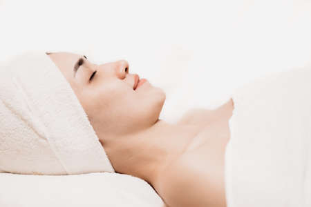Asian women sleeping relax for beauty facial health skin care and hair treatment in spa salon.の写真素材