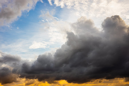 large darkness cloud in the sky with difference sky color from light refraction.