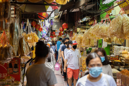 Crowd of people walking shopping for Chinese food resource in Chinatown Yaowarach market and waring face mask for protect Coronavirus(Covid-19). 30 May 2020, Bangkok, THAILAND.のeditorial素材