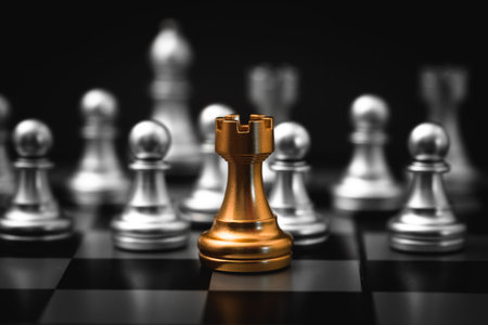Gold Rook or Castle Tower Chess piece closeup on chess board game. Elite Company leader concept.