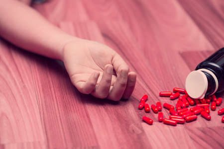 young teen woman take many medicine overdose for suicide from depression disease concept.の写真素材