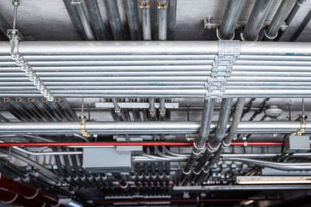 Steel conduit,  electricity cable metal pipe wire good management at building underground.の写真素材