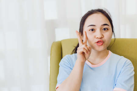 Portrait Asian healthy teen girl cute lovely funny happy action looking cameraの写真素材