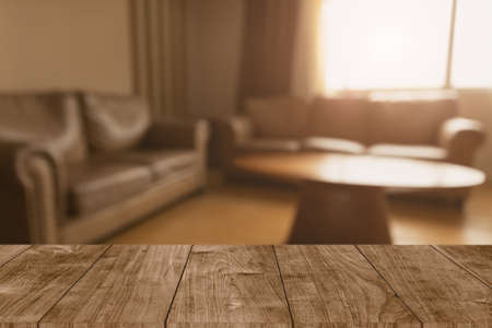 blur classic living room brown leather sofa and wooden table vintage background for home products montage advertising spaceの写真素材