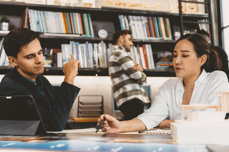 Working woman work with male business team for project discussion in modern office