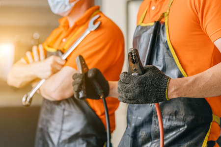 Professional garage staff workers vehicle maintenance and repair service teamの写真素材