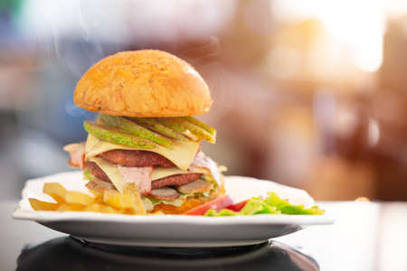 Hamburger or Cheeseburger American style food hot fresh tasty and delicious eat mealの写真素材