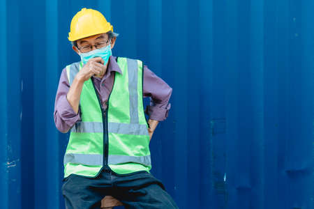 elder old man worker engineer staff pain flu health problem ill from hard workの写真素材