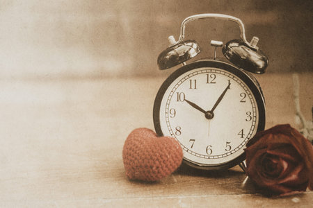 old time retro bell clock love heart with rose vintage color tone with noise and gain effect