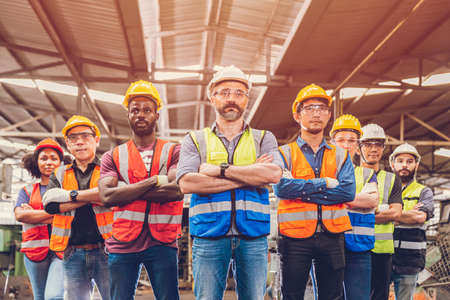 Group of Worker Engineer Teamwork people mix race in Heavy Industry standing confident.selective focus at center manの写真素材