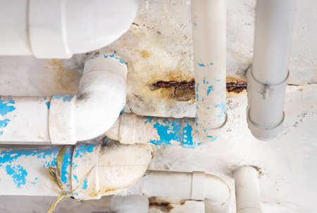 Damaged PVC Water pipe leak , building drainage pipes crack seep problem need to fixの写真素材
