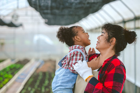happy farmer family mother and child play together cute and lovely