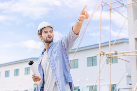 Engineer builder. Foreman work in construction site. senior worker project designer leader concept.の写真素材