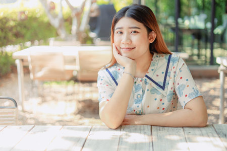 Asian cute young innocent asian teen portrait smile sitting relax leisure good happiness day.